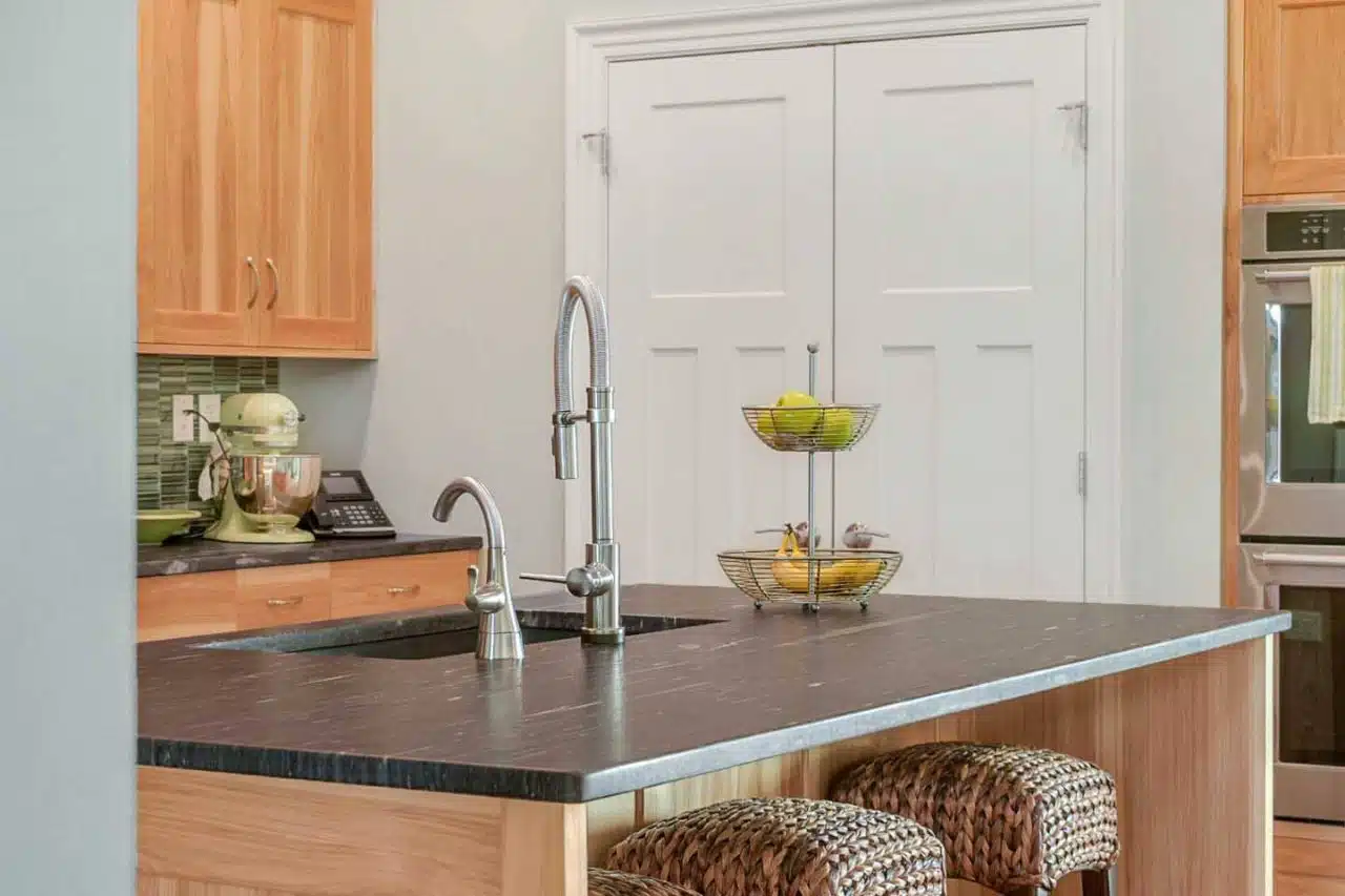 Kitchen island and sink in Ranch-style custom built Leesburg, IN home.