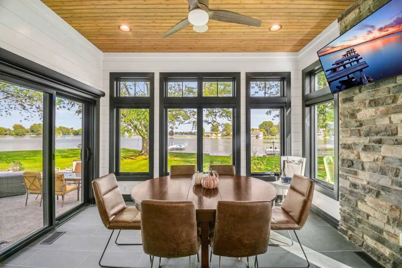 Casual dining room of Winona Lake two-story custom-built home with white siding and black trim.